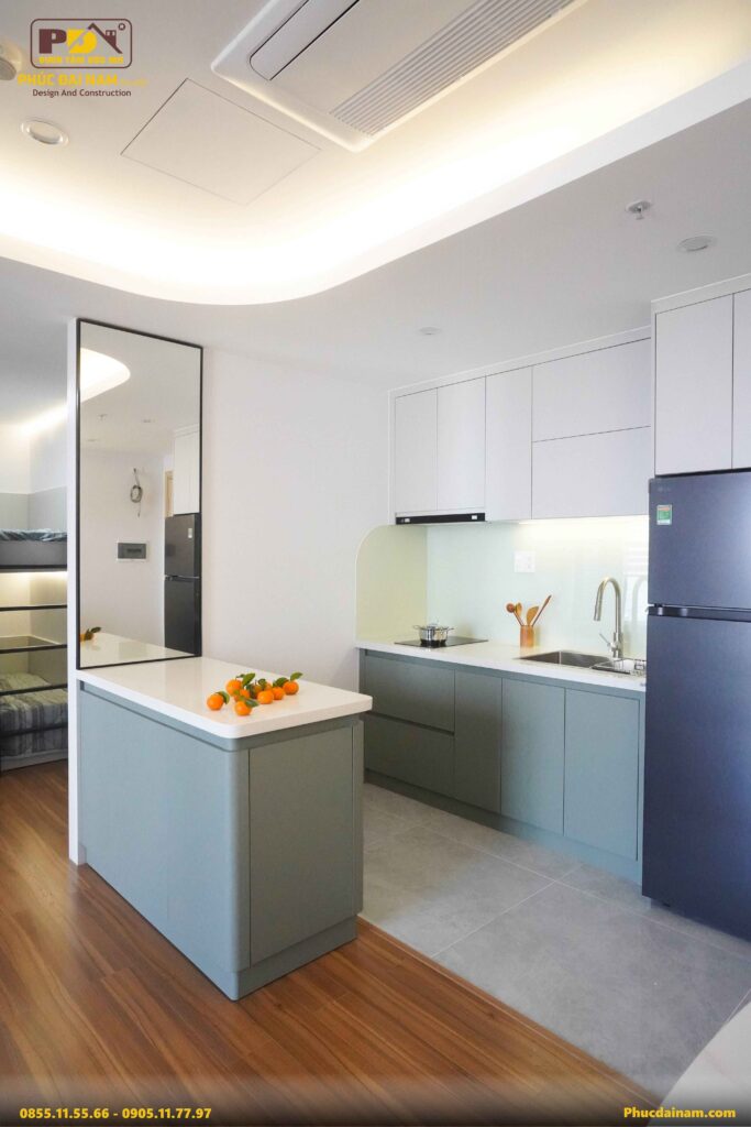 Hệ tủ bếp trong căn hộ Sun Cosmo Đà Nẵng được Phúc Đại Nam sử dụng vật liệu gỗ công nghiệp An Cường cao cấp